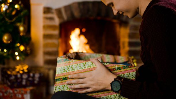 istock Close up of man looking into Christmas gift 1057491988