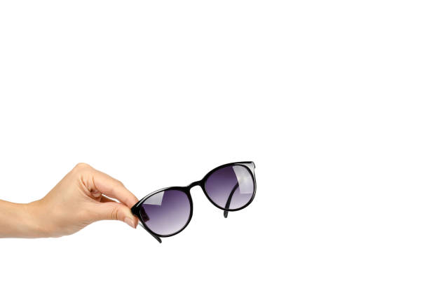 istock Stylish plastic sunglasses with hand isolated on white background, copy space template 1057492840