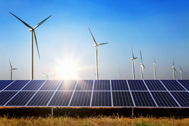 istock solar panel with turbine and sunlight blue sky background. concept clean power energy 1057494590