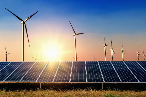 istock solar panel with turbine and sunset blue sky background. concept clean power energy 1057494592