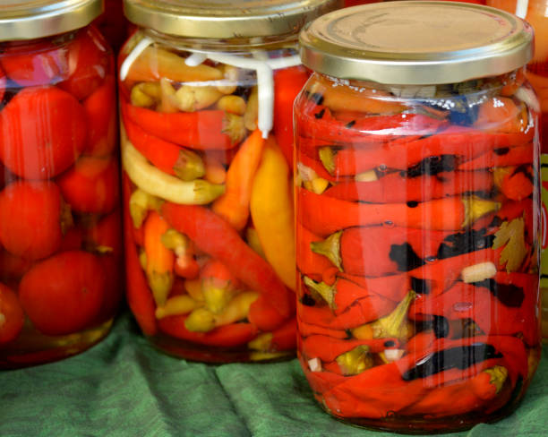 istock Jars with preserved vegetables and fruits on the market stall 1057504134