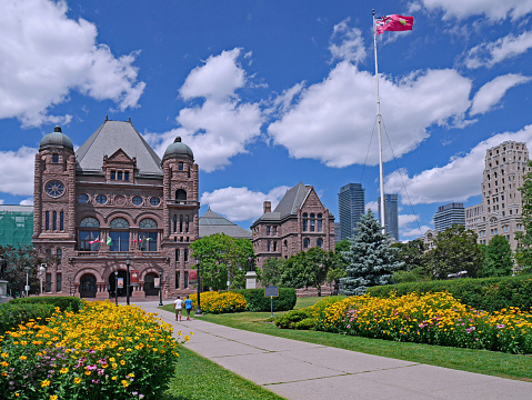 Toronto, Canada - July 17, 2018:  Queen's Park in the center of Toronto is the location of the Ontario provincial parliament building
