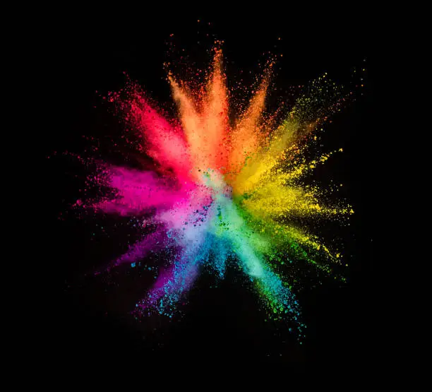 Photo of Colored powder explosion on black background