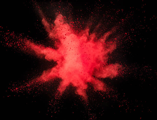 istock Explosion of yellow powder on black background 1057507024