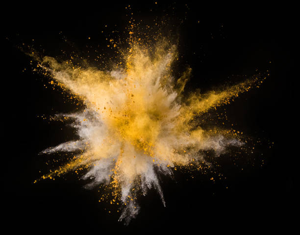 istock Explosion of yellow powder on black background 1057507046
