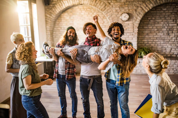 istock Large group of happy creative people having fun at casual office. 1057508596