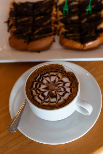istock Coffee in a cup and bread with chocolate 1057508878