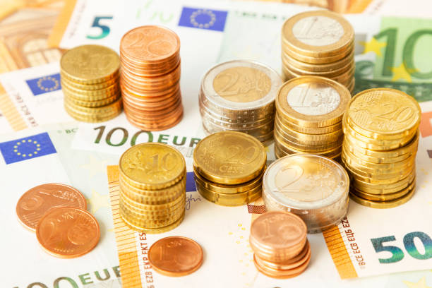 istock Stack of euro coins on euro banknotes, for backgrounds. Germany 1057516666