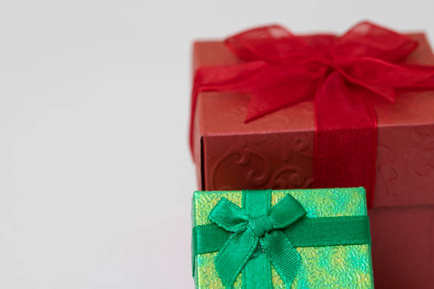 Green gift box  and Red Gift Box with Ribbon and Bow on the White Background, send the good feeling to the special one