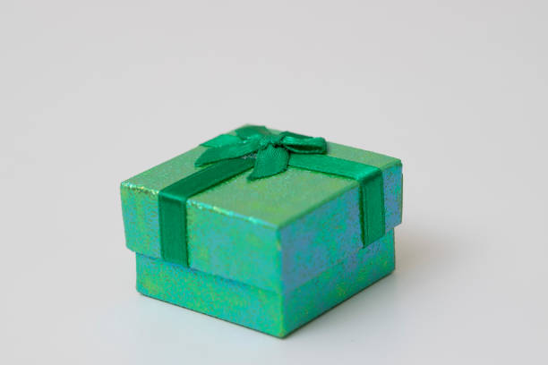 istock Green gift box with Green ribbon isolated on white background. 1057518406