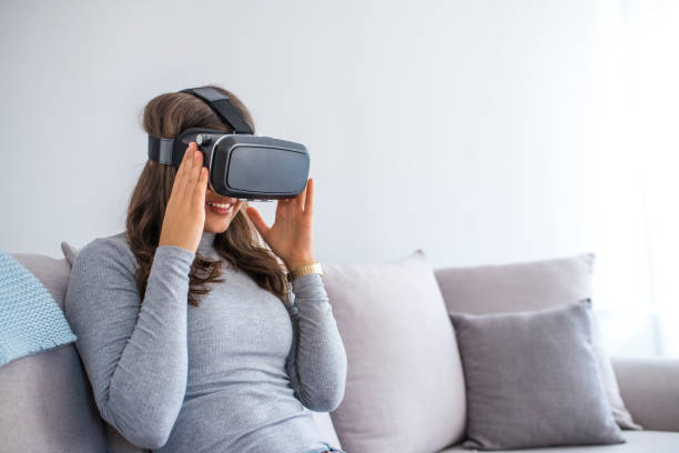 istock Attractive young woman in VR headset 1057525614