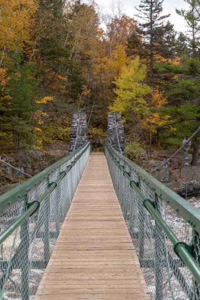 istock Swinging bridge at Jay Cooke State Park in Autumn 1057525780