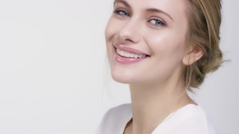 Portrait of beautiful woman touching her face