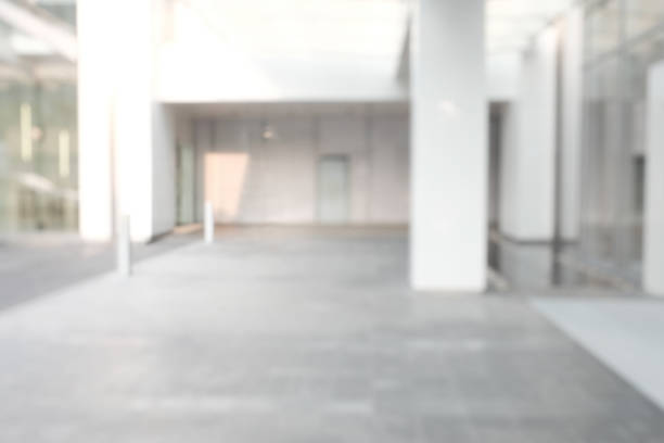 istock Business building blur background office lobby hall interior empty indoor room with blurry light from glass wall window.