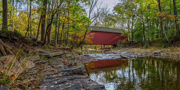 The Cabin Run Covered Bridge spans Tohickon Creek in Bucks County Pennsylvania.