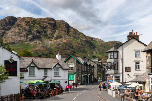 Village center of Coniston with the Old Man of Coniston mountain rising behind houses.
Coniston is a good center for walkers and climbers stock photo