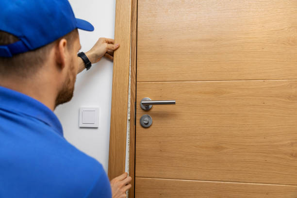 man installing door architrave man installing door architrave moulding door jamb wood stock pictures, royalty-free photos & images