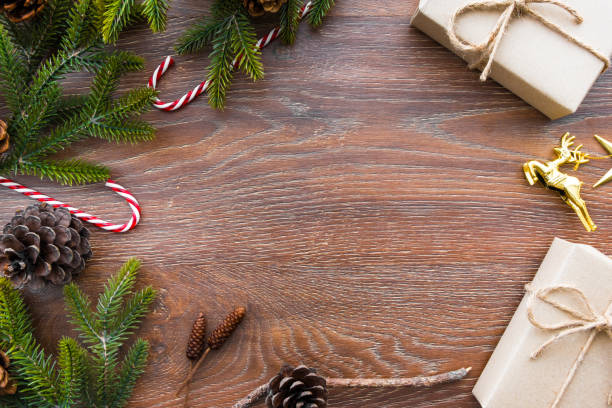 istock Christmas composition background on wood table with gift box and some decorations. Top view with copy space, flat lay. 1057539034