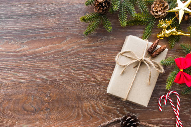 istock Christmas composition background on wood table with gift box and some decorations. Top view with copy space, flat lay. 1057539038