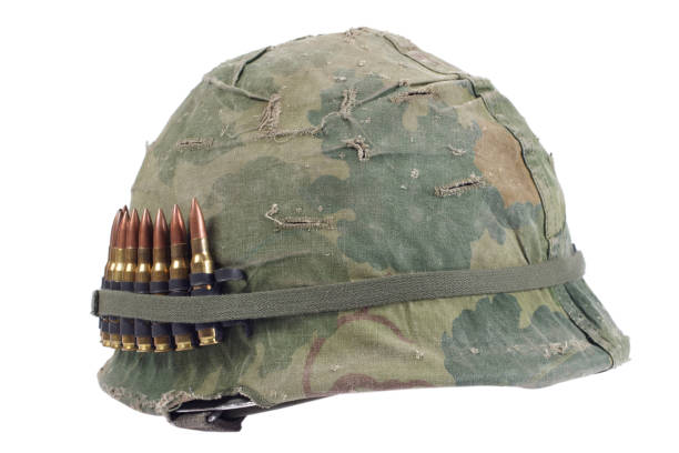 US Army helmet with camouflage cover and ammo belt - Vietnam war period US Army helmet with camouflage cover and ammo belt - Vietnam war period isolated grunt fish photos stock pictures, royalty-free photos & images