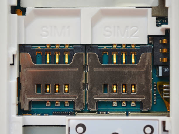 Two SIM card slots in old white mobile phone