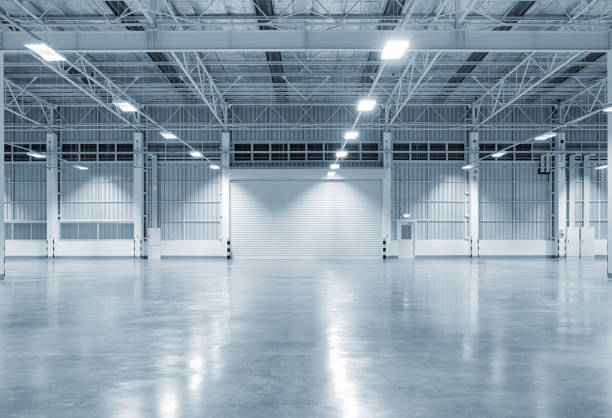 factory building background Factory building or warehouse building with concrete floor for industry background. airplane hangar stock pictures, royalty-free photos & images