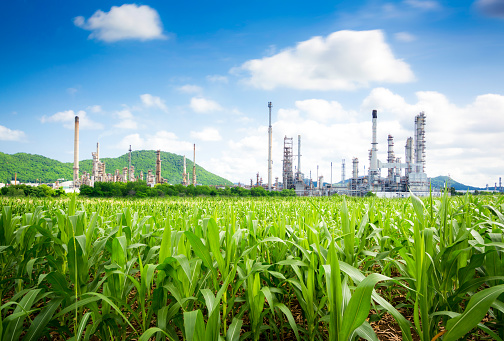 Drone stock photo of a big factory with smoking chimneys.