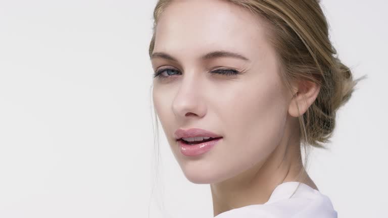 Close-up portrait of beautiful winking woman