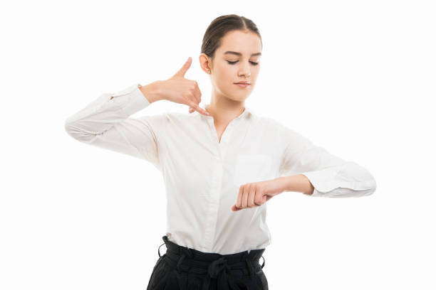 Portrait of young pretty business woman making phone appointment isolated on white background with copy space advertising area