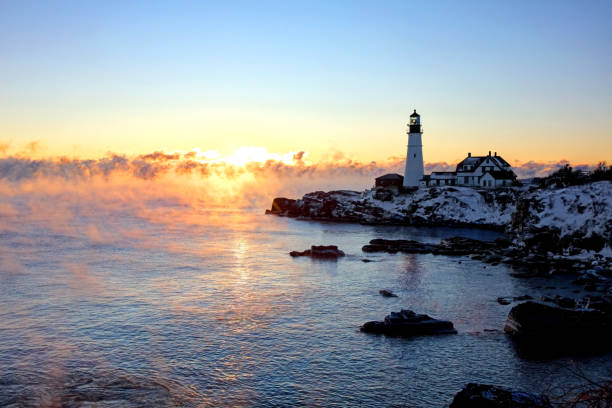 istock Portland Head Lighthouse in Arctic Sea Smoke 1057552422