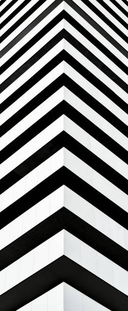 istock Black and white modern building vertical facade. Perfect for wallpaper, wrapping, fabric, background, template, prints, banners 1057556112