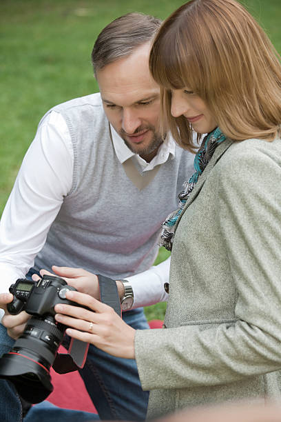istock man and woman holding photo camera 105755985