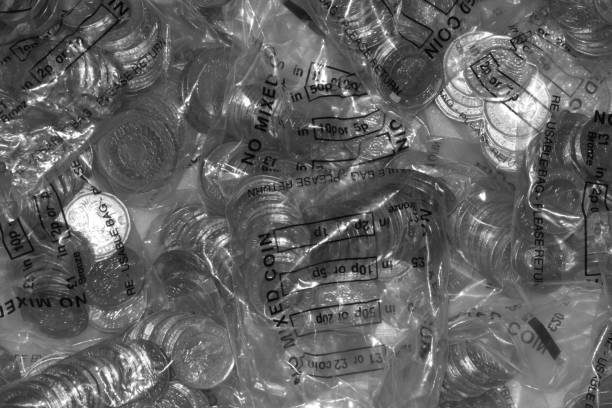 bags of british money, black and white - two pound coin imagens e fotografias de stock