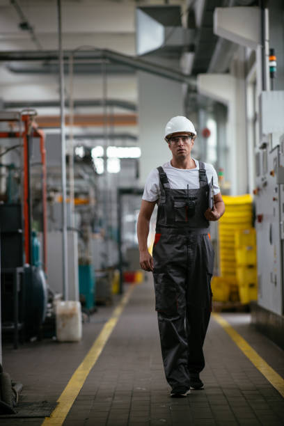 istock Young handsome factory worker 1057563560