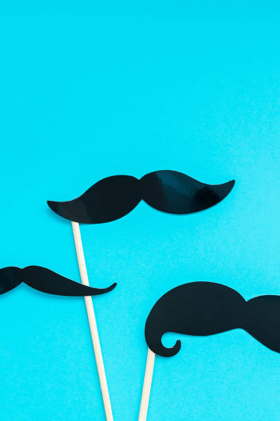 istock Paper moustaches for men fathers dad concept 1057564616