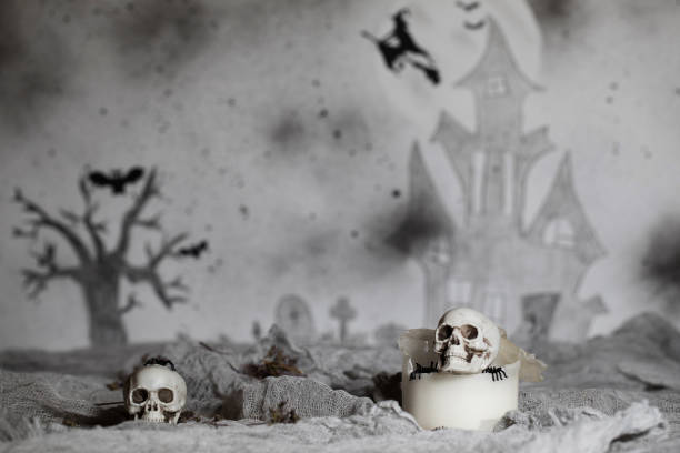 istock Skull on an old used thick candle. 1057569970