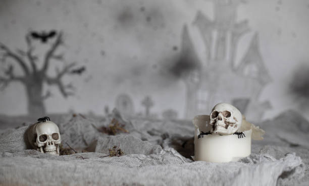istock Skull on an old used thick candle. 1057569972