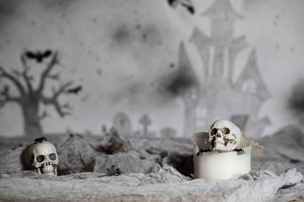istock Skull on an old used thick candle. 1057570304