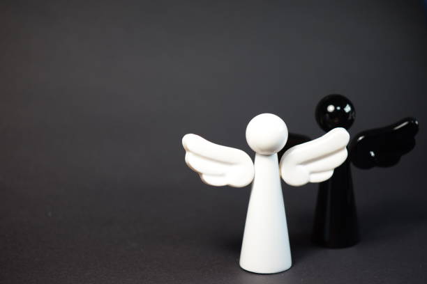 istock A white angel and a black angel 1057570444
