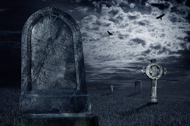 Tombstone Old tombstone with a dark sky. Add your text. Halloween theme. place of burial photos stock pictures, royalty-free photos & images