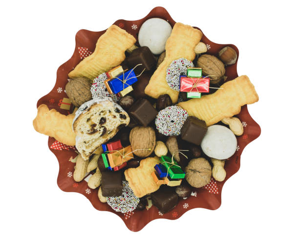 Christmas plate with different varieties of cookies, chocolate and nuts