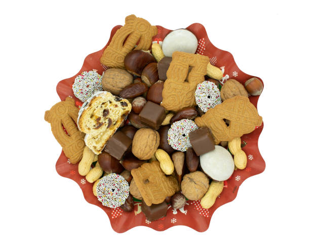 Christmas plate with stollen, speculoos, chocolate, dates and nuts