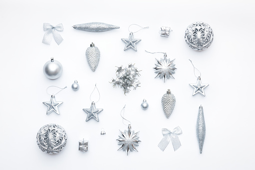 Beautiful silver christmas ornaments isolated on white background. Christmas composition.