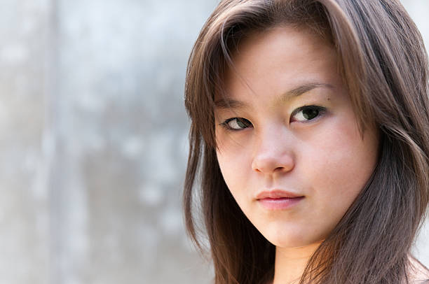 istock Attractive Young woman looking at camera 105757408