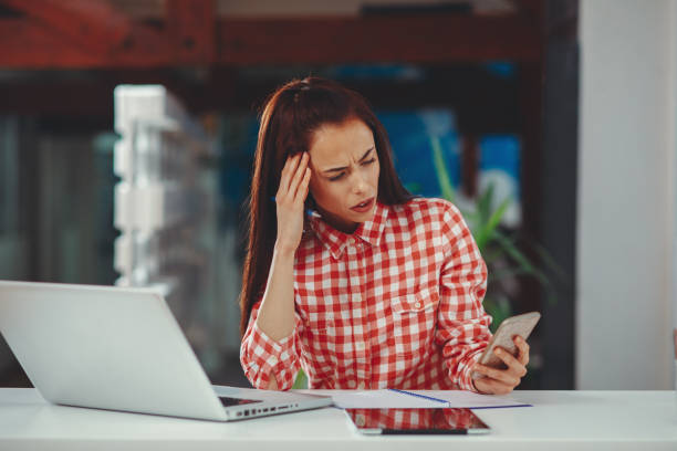 istock Women in the office typing a message on the phone 1057578410