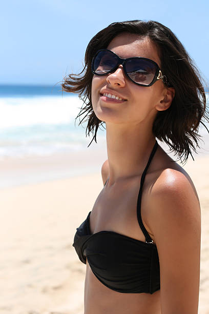 istock Beautiful Girl Relaxing on the Beach 105757860