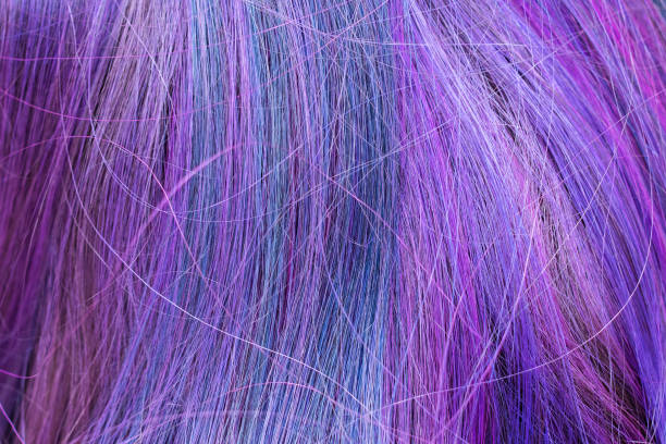 istock blue and purple colored hair strands 1057582144