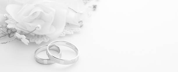 istock Wedding rings on wedding card on a white background, border design panoramic banner 1057590904