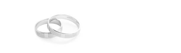 istock Wedding rings on wedding card on a white background, border design panoramic banner 1057590906