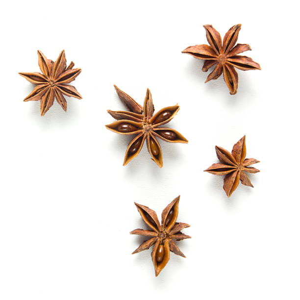 istock Star anise, scattered in a chaotic manner, isolated on white background 1057590986